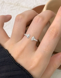 Close-up of S925 sterling silver shell-shaped open ring with cubic zirconia stones