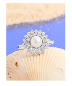 Detailed close-up of a sunflower S925 silver ring with a white pearl and zircons