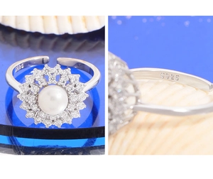 Macro view of S925 sterling silver stamp on adjustable flower pearl ring with zircons