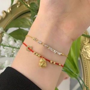 Adjustable S925 silver bracelet with gold money bag charm and red braided lucky rope