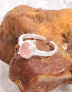 Macro shot of S925 sterling silver stamp and pink strawberry quartz on ring