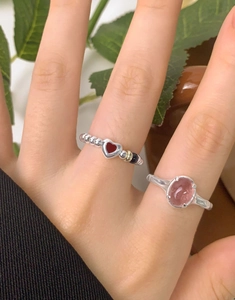 Detail of S925 silver ring featuring strawberry quartz and a heart-shaped design
