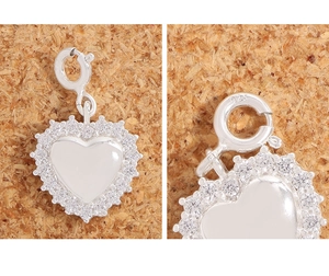 Close-up of heart pendant showing S925 sterling silver hallmark and cubic zirconia stones