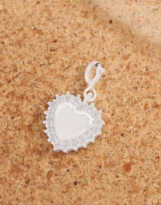 Macro detail of S925 silver heart pendant with cubic zirconia and lobster clasp