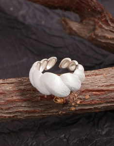 Detailed macro view of S925 sterling silver croissant ring with brushed matte texture