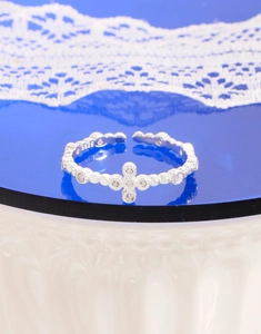 Close-up of S925 sterling silver stamp and zircon cross details on the open ring