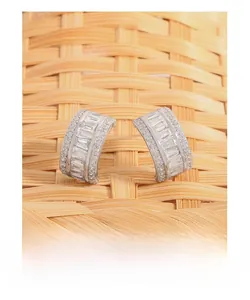 Close-up of S925 sterling silver C-shape earrings with rectangle and round zircon stones