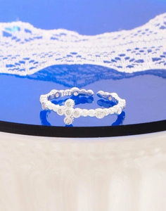 Detailed close-up of S925 silver bubble cross ring with cubic zirconia stones
