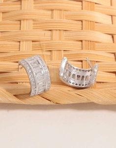 Macro detail of S925 sterling silver earring featuring inlaid baguette cut zircons