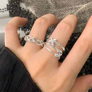 Interwoven 925 silver rings with braided lines and delicate flower motifs for women