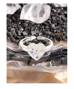 Detailed macro of S925 silver lava heart ring with star zircon and textured finish