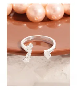 Detailed view of S925 sterling silver open ring with star and liquid metal design