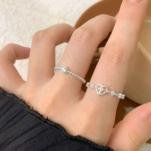 S925 sterling silver heart cross and beaded rings with zircon on a female hand
