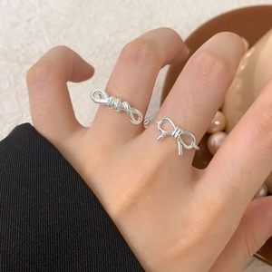 Elegant S925 sterling silver bow knot open rings set shown on a woman's hand