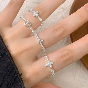 Four-piece S925 silver ring set with cross and heart motifs and cubic zirconias