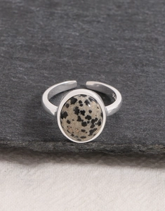 Detailed view of the S925 sterling silver ring band with natural dalmatian stone on slate