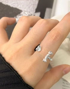 On-hand shot of S925 sterling silver wing heart open ring with elegant bow design