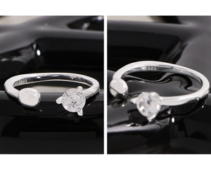 Macro shot of S925 sterling silver open ring with clear zircon in four-claw setting