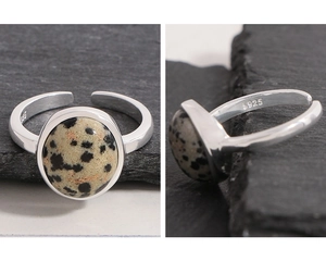 Detailed close-up of S925 sterling silver ring featuring a round natural dalmatian stone