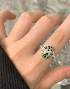 Detailed macro view of S925 sterling silver ring featuring an oval Dalmatian Jasper stone