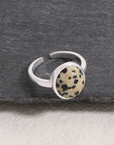 Macro view of adjustable silver ring featuring oval Dalmatian Jasper natural stone