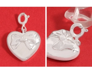 Detailed macro view of S925 sterling silver heart pendant with 925 hallmark engraving