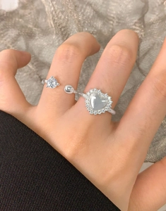 Macro shot of S925 sterling silver ring featuring zircon heart and round sphere details
