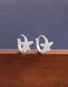 Close-up of S925 silver starfish hoop earrings with sparkling cubic zirconia inlay