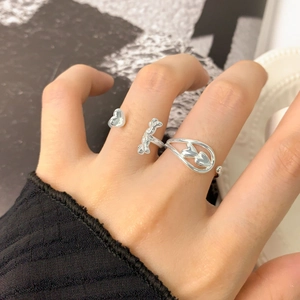 Three-piece S925 sterling silver ring set featuring heart charms and irregular textures