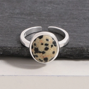S925 sterling silver open ring with round natural spotted stone on dark slate