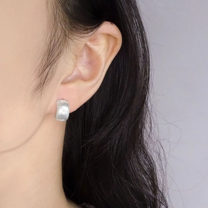 Brushed starburst S925 sterling silver stud earrings with frosted texture for women