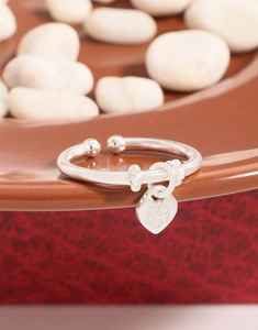 Detailed close-up of S925 sterling silver heart charm ring with engraved floral patterns