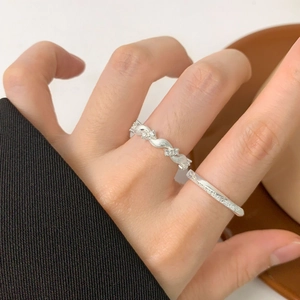 Frosted Mobius silver ring set with zircon twist design and minimalist band on model