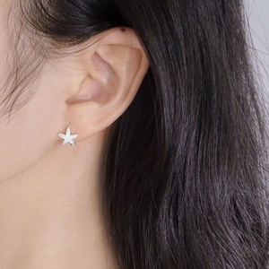S925 sterling silver starfish hoop earrings with sparkling cubic zirconia on model
