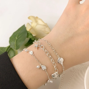 Minimalist S925 sterling silver ocean theme bracelet set with starfish and shell charms