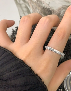 Detail of S925 sterling silver ring with molten lava texture and irregular heart design