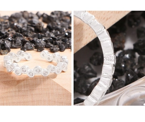 Macro detail showing S925 hallmark on sterling silver ring with sparkling cubic zirconia