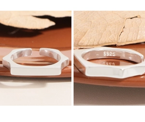 Detailed view of S925 sterling silver stamp on minimalist geometric hexagonal ring
