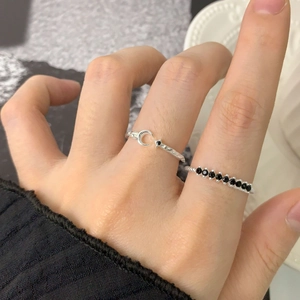 Stackable S925 silver twist rings featuring black zircon moon and star accents