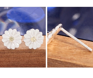 Detailed macro view of S925 sterling silver daisy stud earrings with yellow zirconia