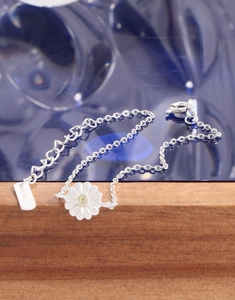 Close-up of S925 sterling silver daisy bracelet with yellow zircon and lobster clasp