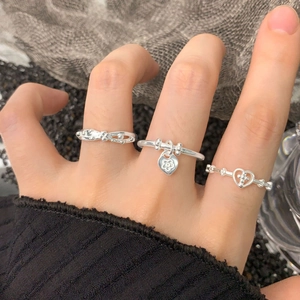Three-piece S925 sterling silver ring set featuring heart charms and floral designs
