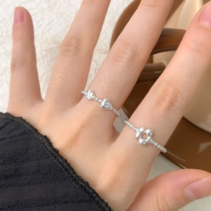 S925 sterling silver flower and heart ring set with zircons shown on hand