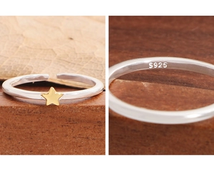 Macro shot of S925 sterling silver ring detail with engraved hallmark and gold star