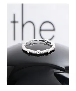 Detailed view of S925 sterling silver heart ring band with internal hallmark engraving