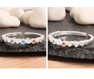 Detail view of heart-shaped S925 sterling silver ring with colorful zircon stones