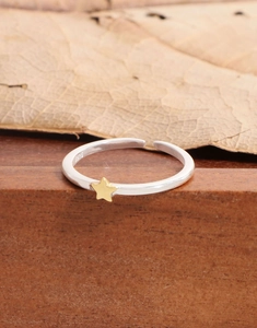Macro detail of S925 sterling silver ring showing the engraved hallmark and gold star charm