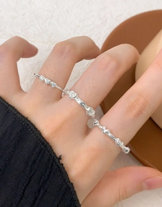 Detailed close-up of multi-finger heart ring featuring zircon inlay and S925 silver finish