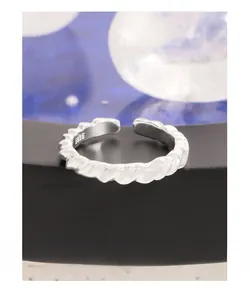 Macro view of S925 sterling silver stamp on the inner band of irregular twisted ring