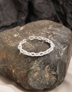 Detail of S925 sterling silver chain ring with adjustable opening on natural stone